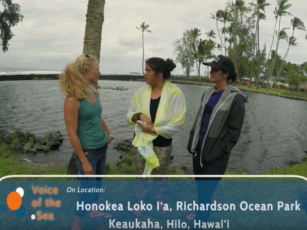 UH Sea Grant Kanesa Duncan Seraphin talking with Kamala Anthony and Cherie Kauahi in front of Waiuli fishpond.