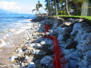  Sandbags protect buildings on an eroding shoreline.