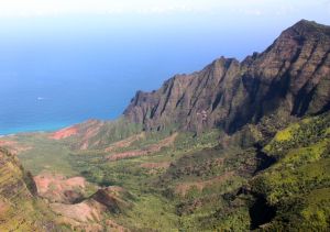 A view down a steep sided, U-shaped valley to the ocean