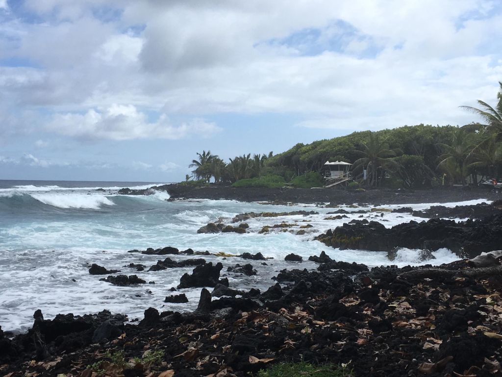 High water floods a rocky coastline