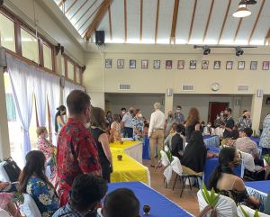 Youth Delegation gathering event with everyone sitting at tables.