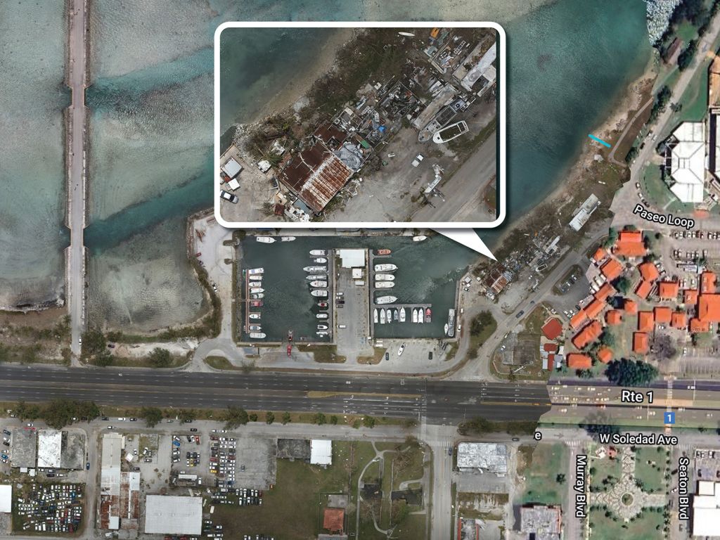 A satellite image of a boat basin along a coastline in Hagåtña, Guam, is shown. An inset image shows a close-up look of damaged property from typhoon-force winds.