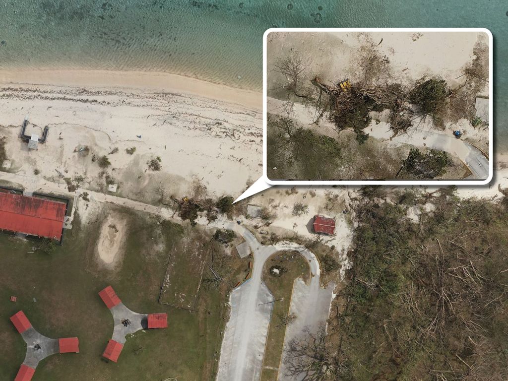 A satellite image shows a beach park in Tumon, Guam. An inset image shows a close-up view of fallen trees as a result of typhoon damage.