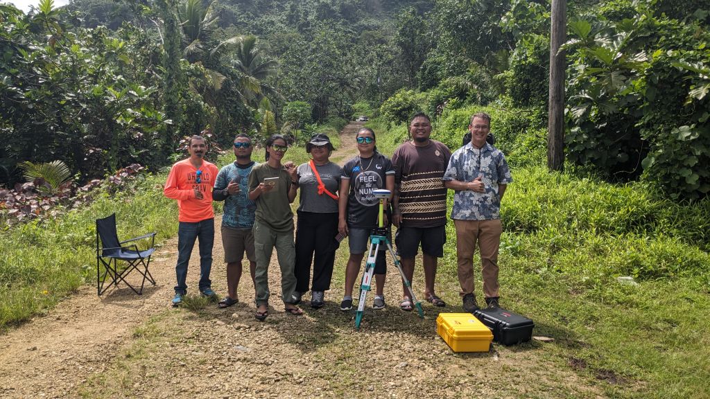 Group photo outside with participants and Dr. Rodriquez and Dr. Ryan Perroy