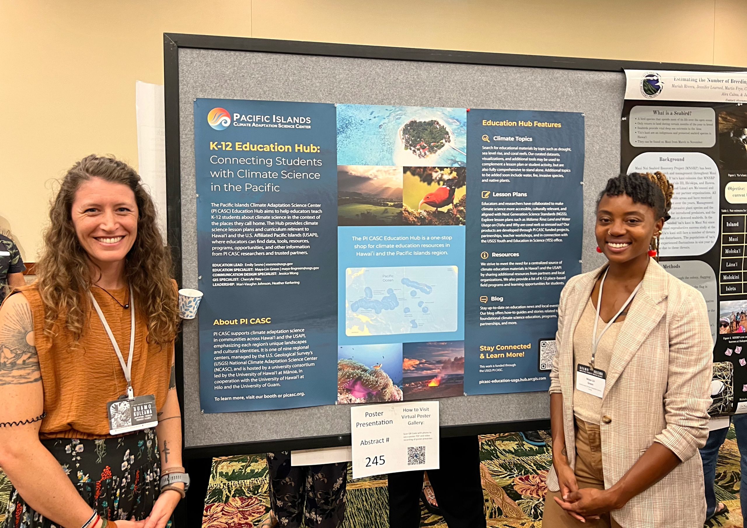 Emily Sesno and Maya-Lin Green stand in front of their poster.