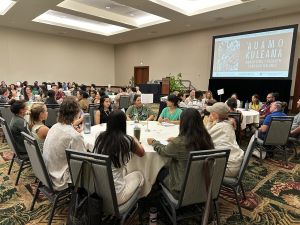 Photo of the forum attendees in their discussion groups.