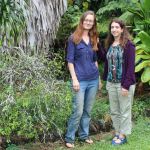 Joanna and Becky stand together outdoors.