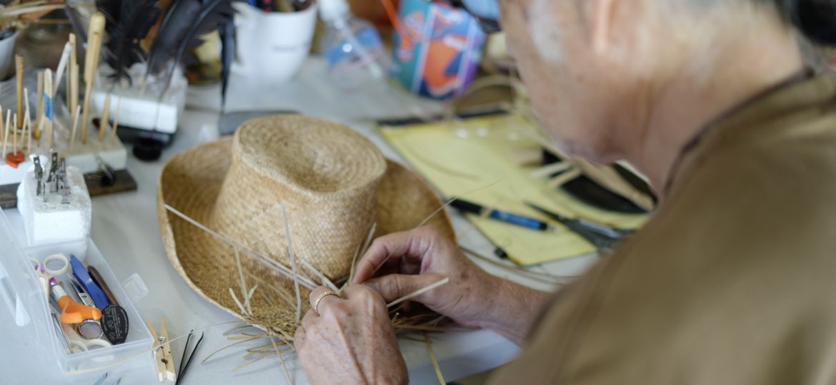 Duncan Kaʻohu Seto, shown weaving a pāpale (hat)