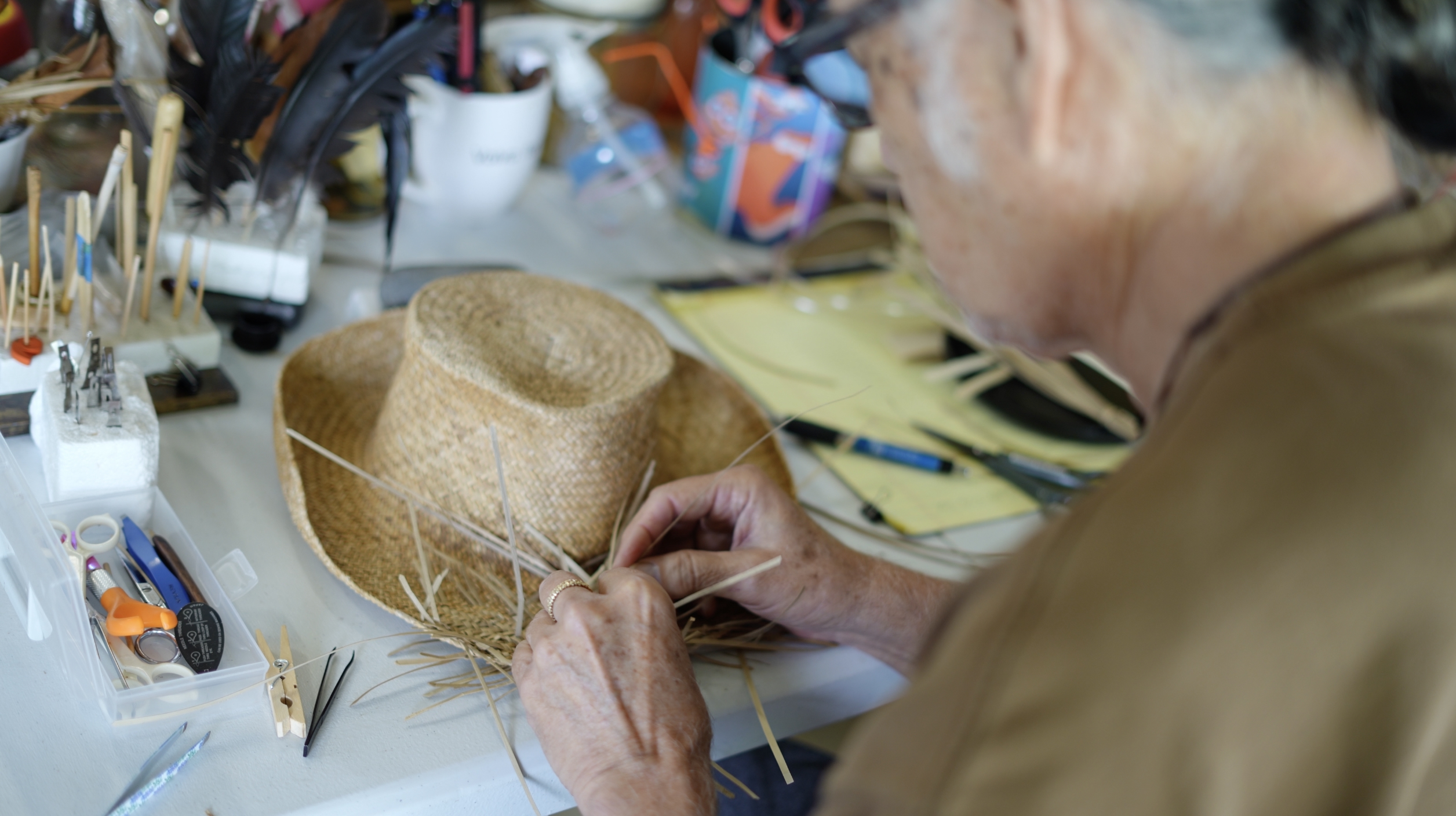 Duncan Kaʻohu Seto, shown weaving a pāpale (hat) 